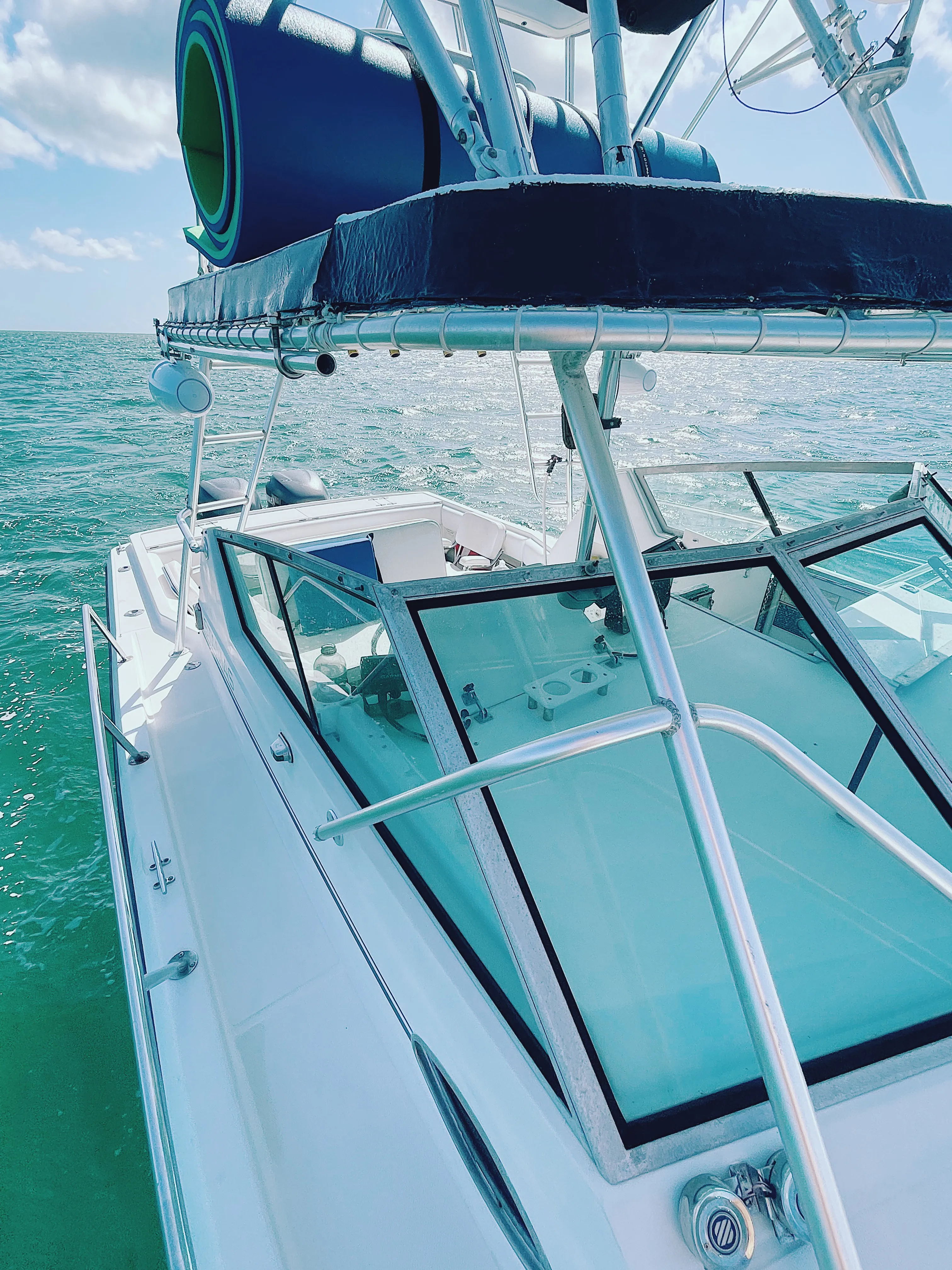Helm and observation tower of the 32 ft Stamas underway over green water near Key West